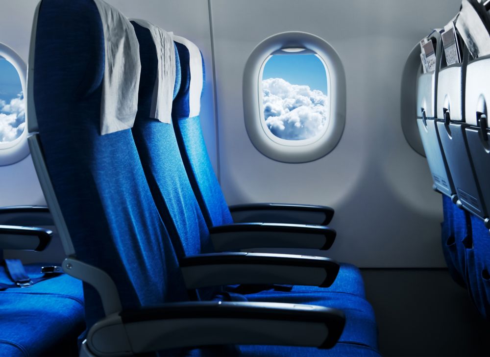 Empty airplane seats. 