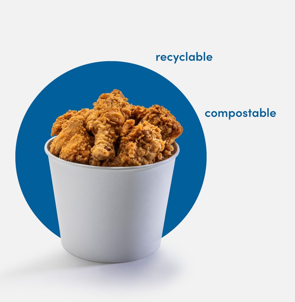 Fried chicken in a white paper bucket. 