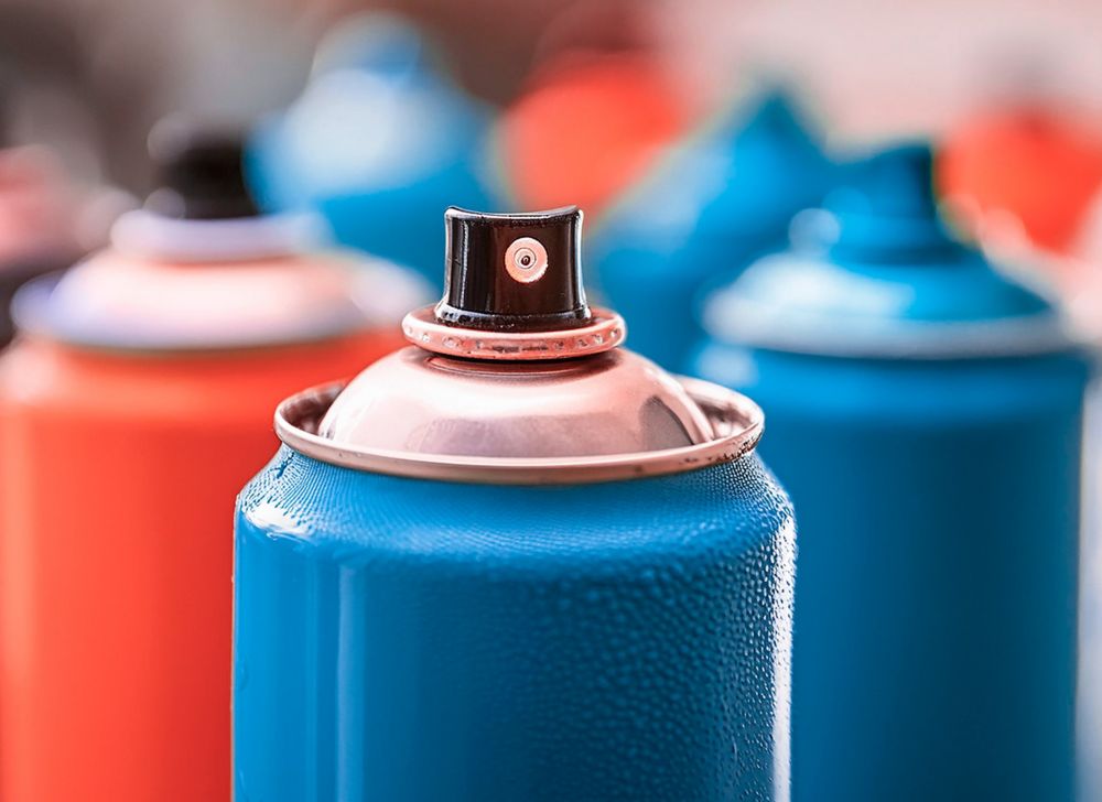 Close-up of an aerosol spray nozzle. 