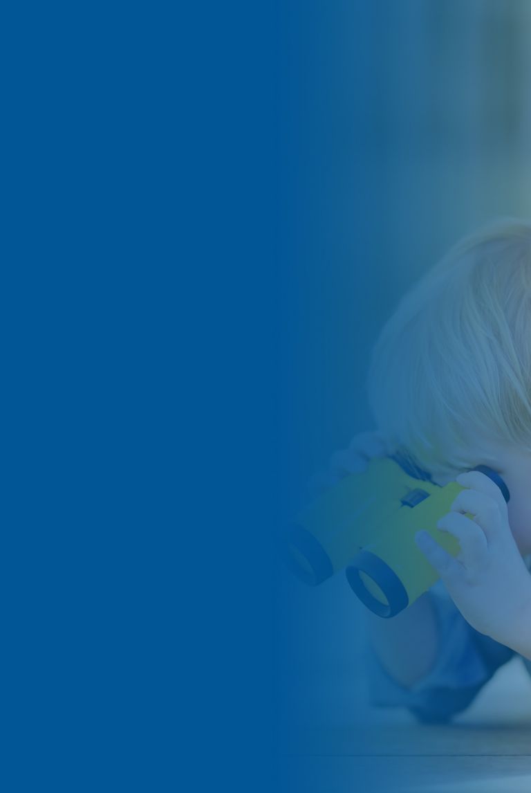 Blue banner fade over a picture of cute little boy playing with rubber duck and plastic binoculars outdoors. 