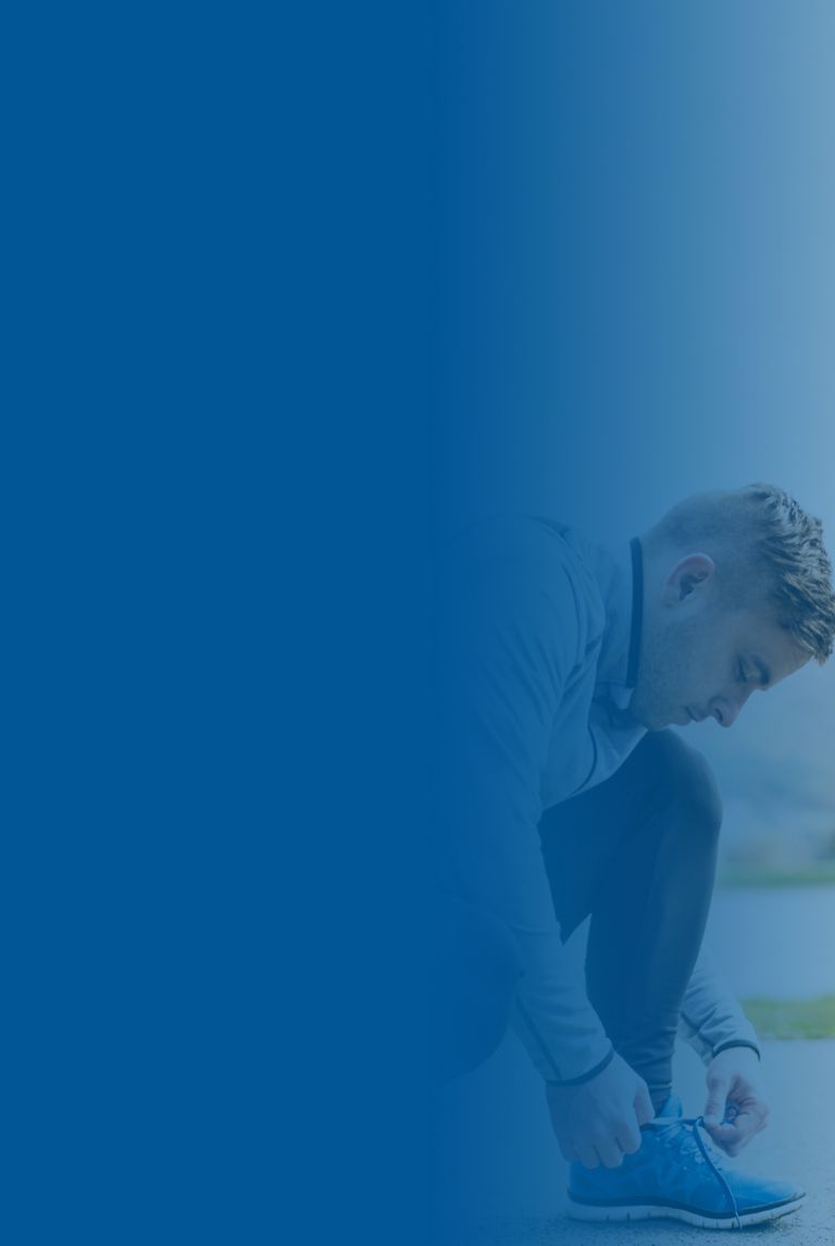 Blue banner fade over a picture of handsome young runner tying shoelaces. 