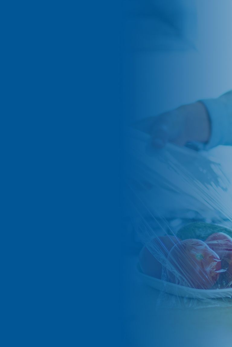 Blue banner fade over a picture of woman using food film for food storage. 