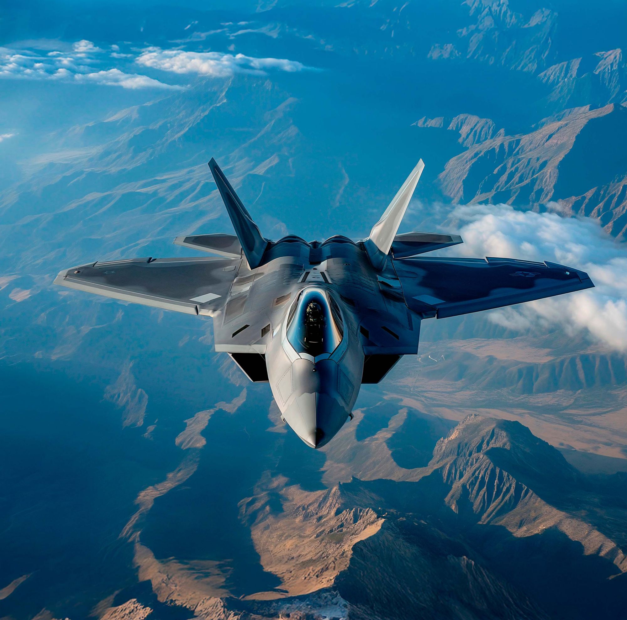 A fighter jet is seen in the sky from in front of the plane. 