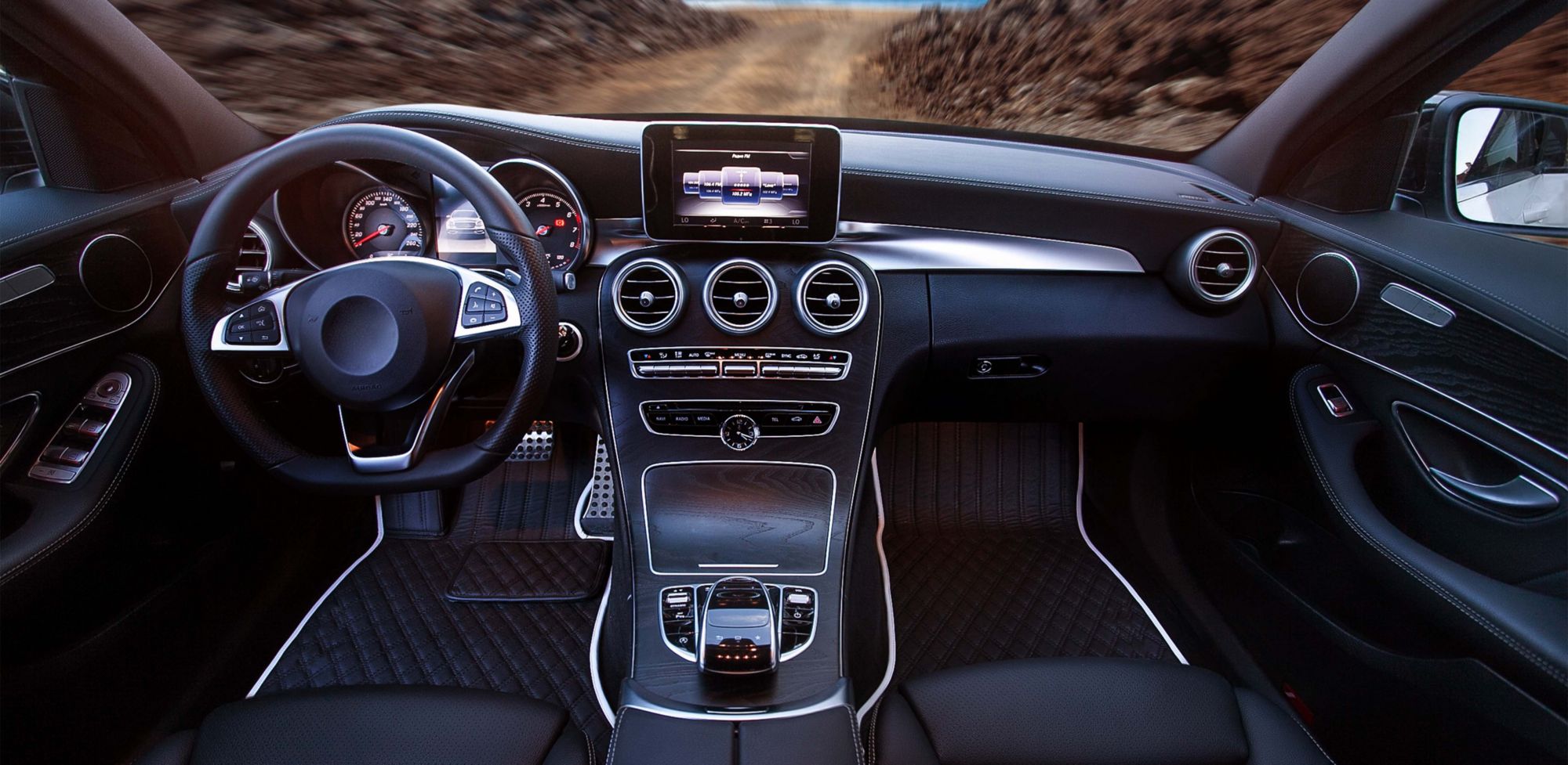 Black car interior on the road. 