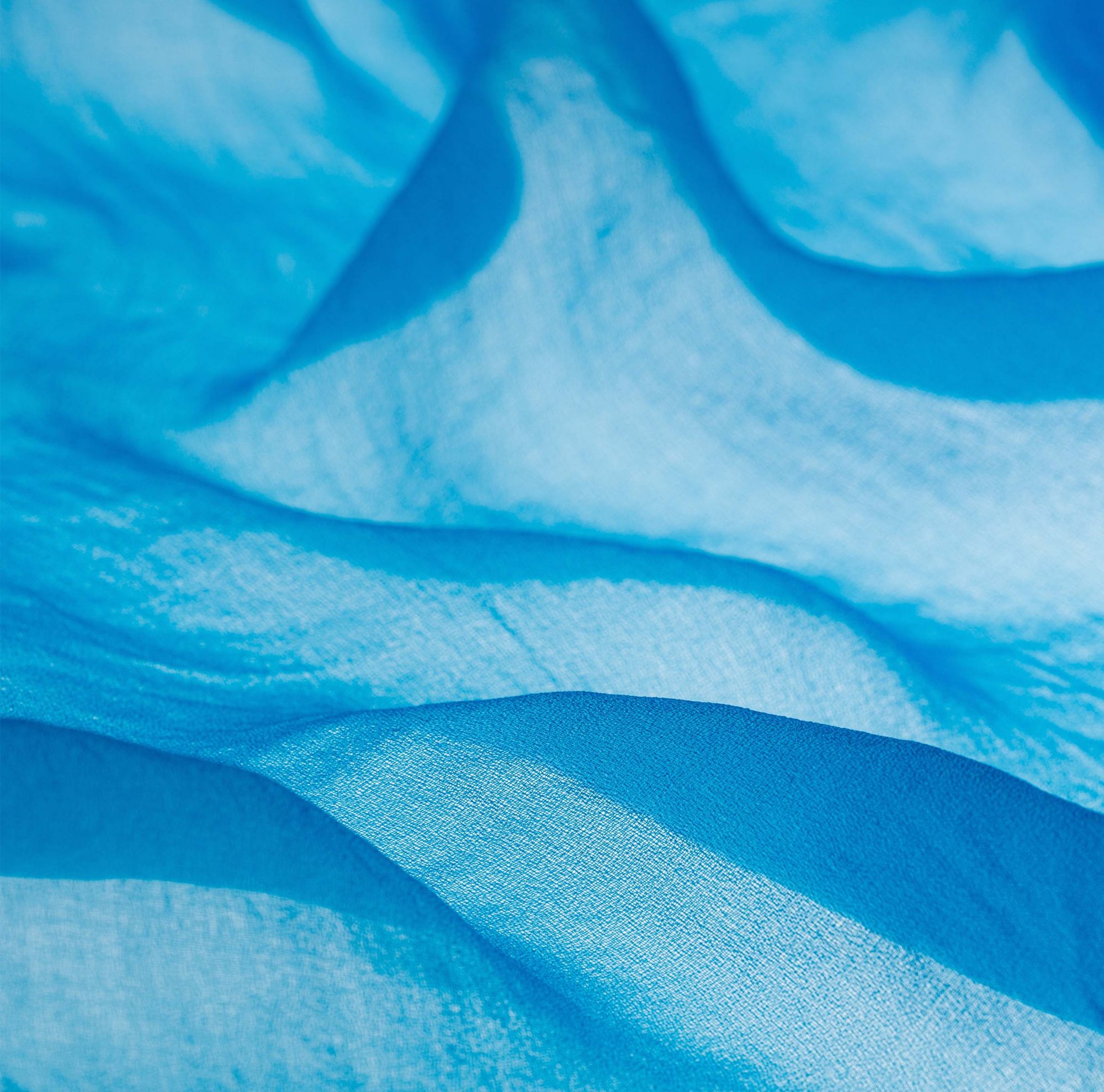 Close-up of lightweight, light blue Naia Lyte fabric with a soft texture.  