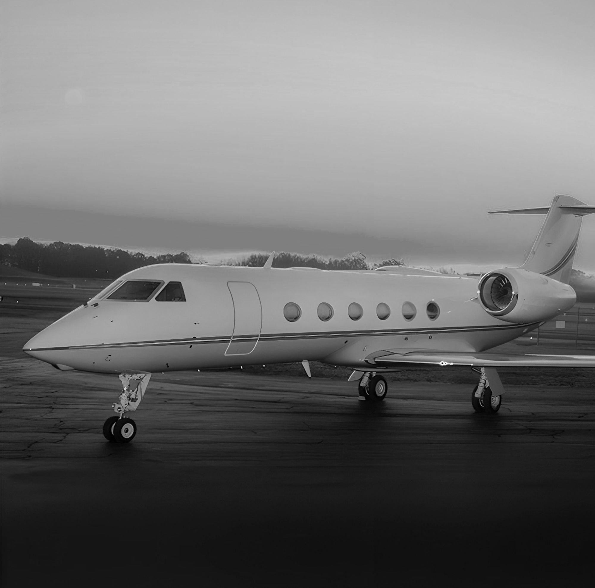 A small jet is shown grounded on a runway. 
