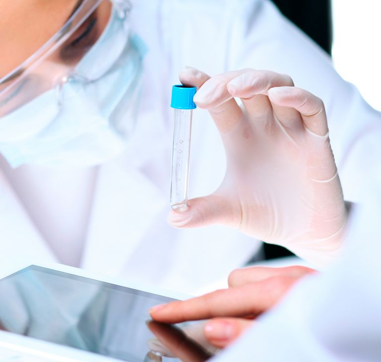 A chemist holding a test tube. 