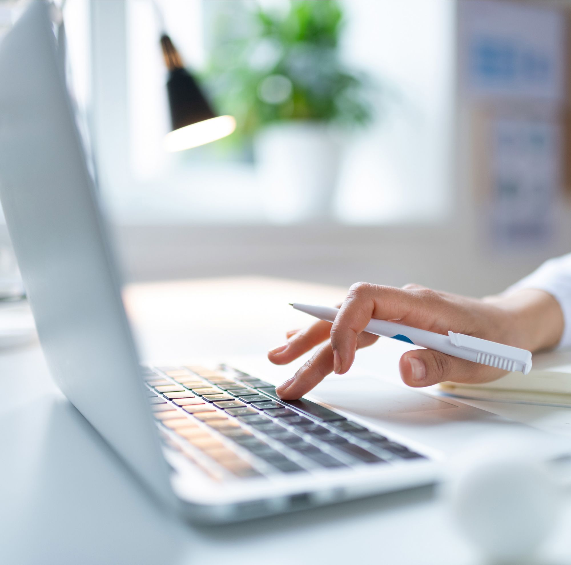 A chemist using a laptop 