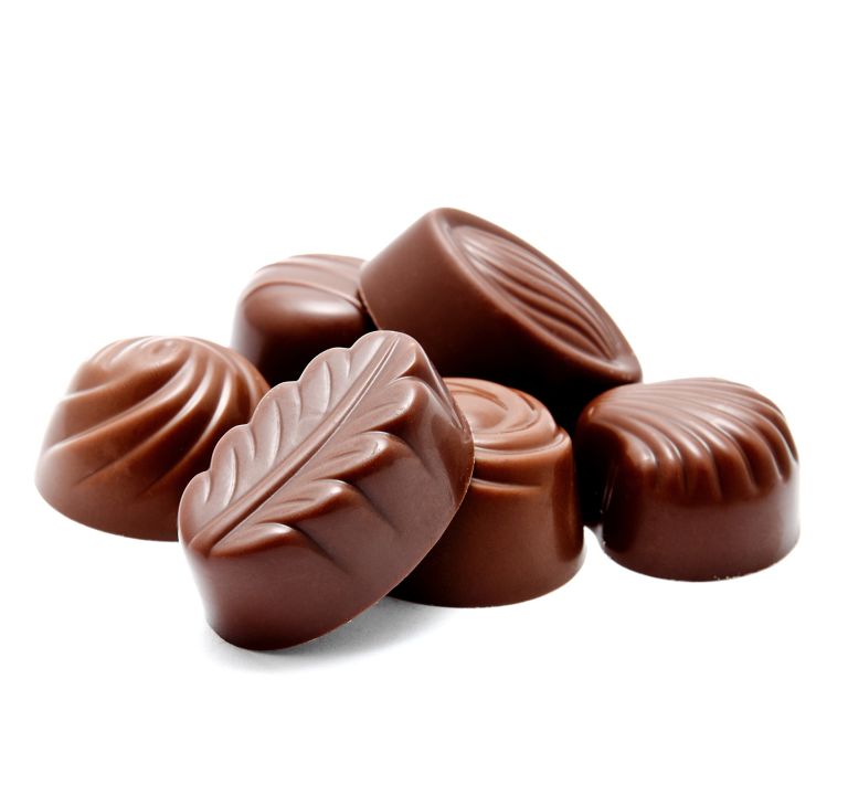 Six decorative chocolate candies arranged in a small pile. 