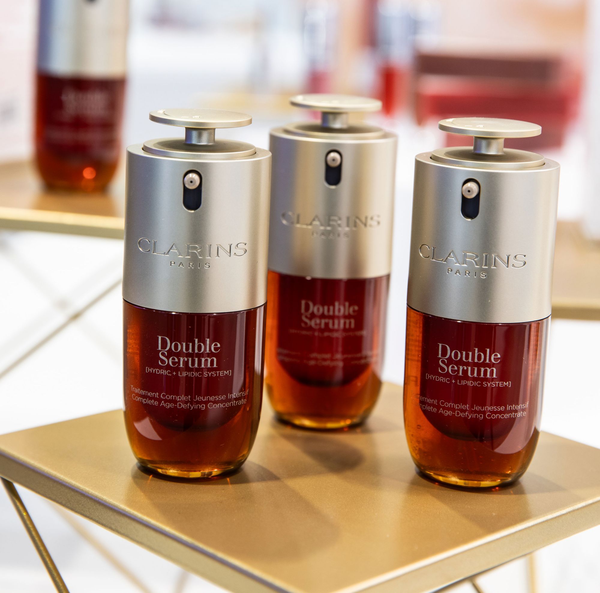 Three bottles of Clarins Double Serum made from Eastman Cristal. 