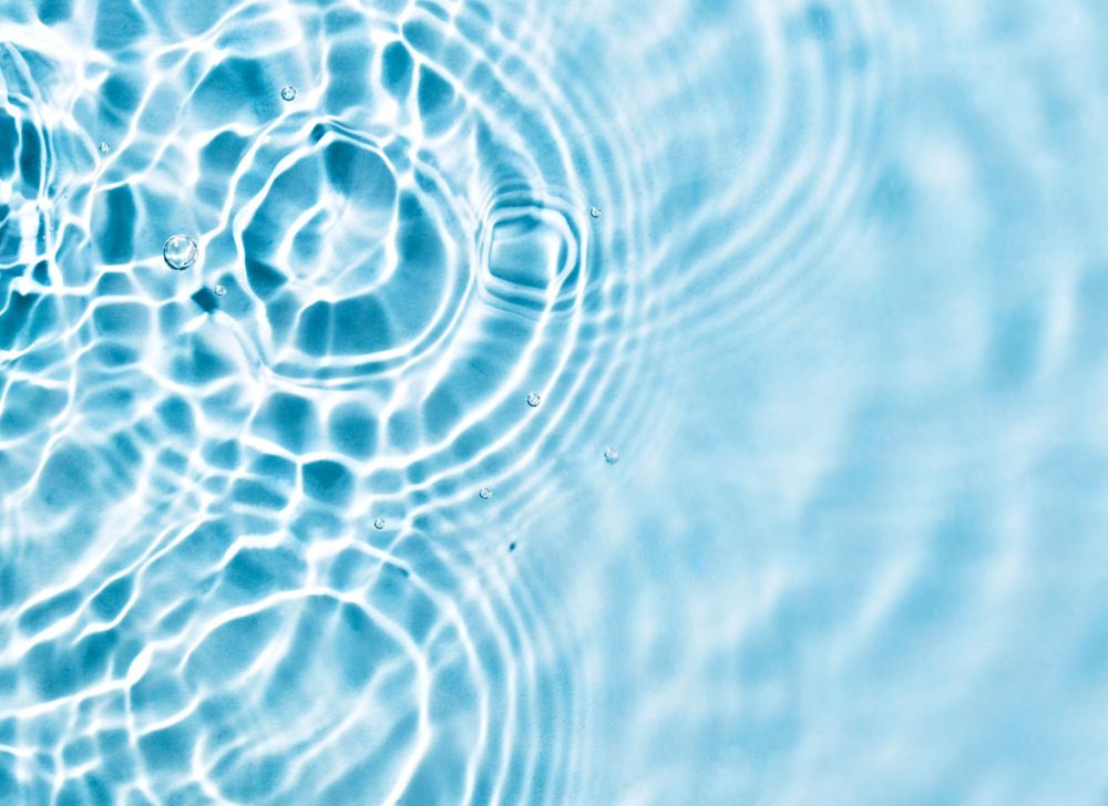 A droplet into liquid causes a series of ripples. 