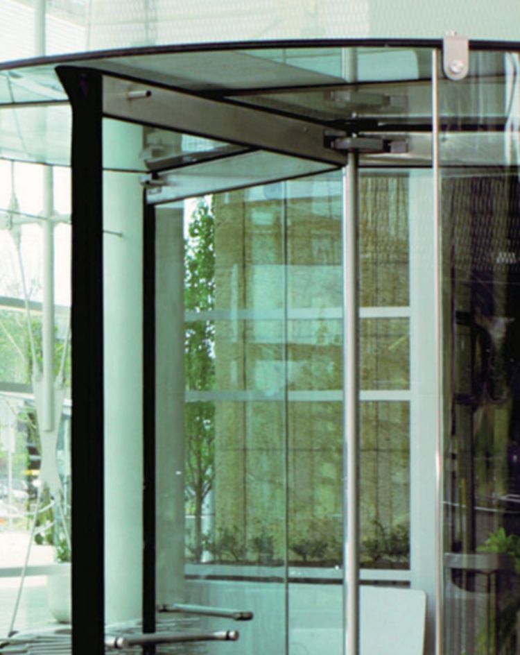 Glass revolving door at the entrance of a modern building. 