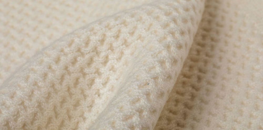 closeup beige sweater 