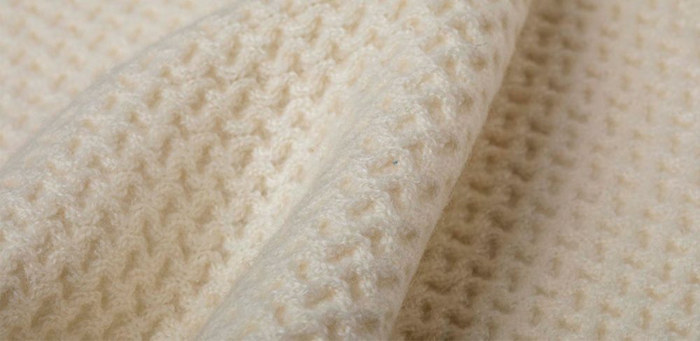 closeup beige sweater 