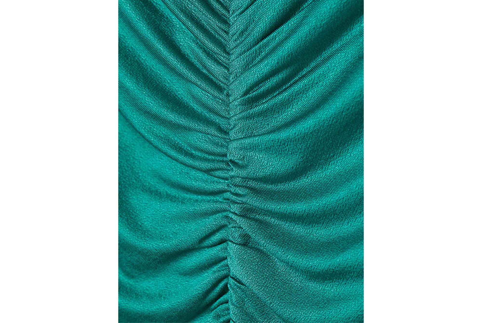 Close up of H&M brand emerald green dress made of 91% cellulose acetate Eastman Naia™ 