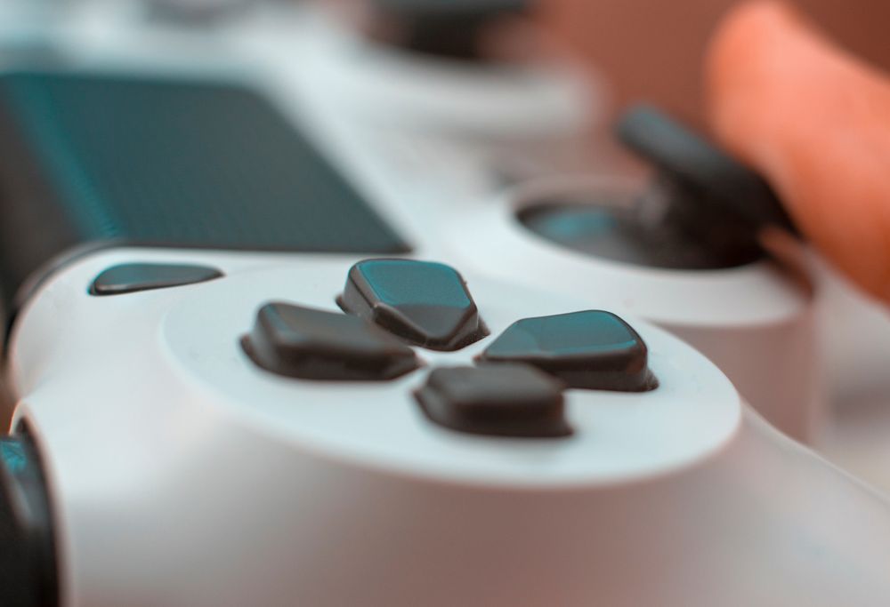 A closeup of a video game controller is shown. 