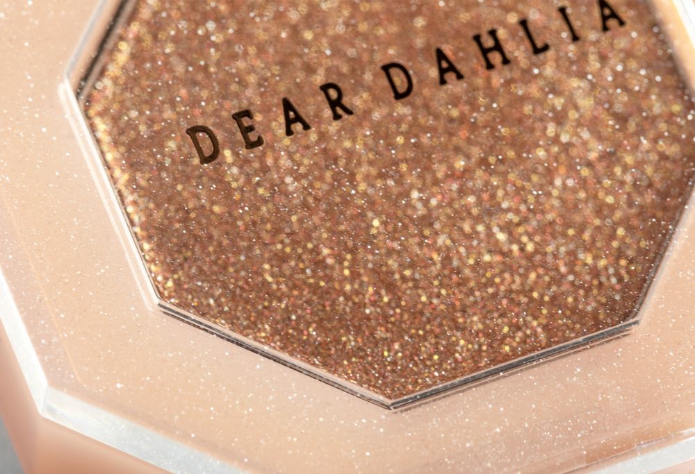 Close-up of a glitter cosmetic compact case 