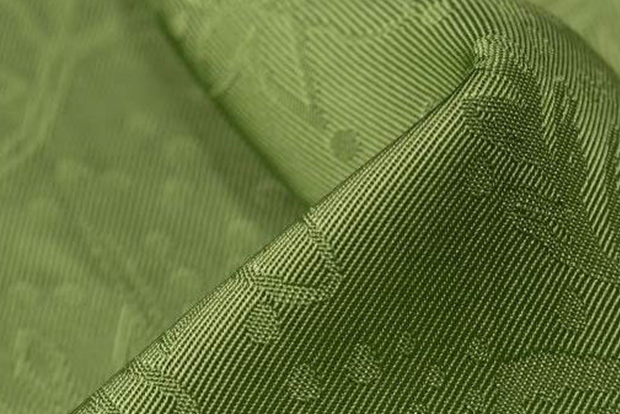 Closeup green satin patterned cloth 