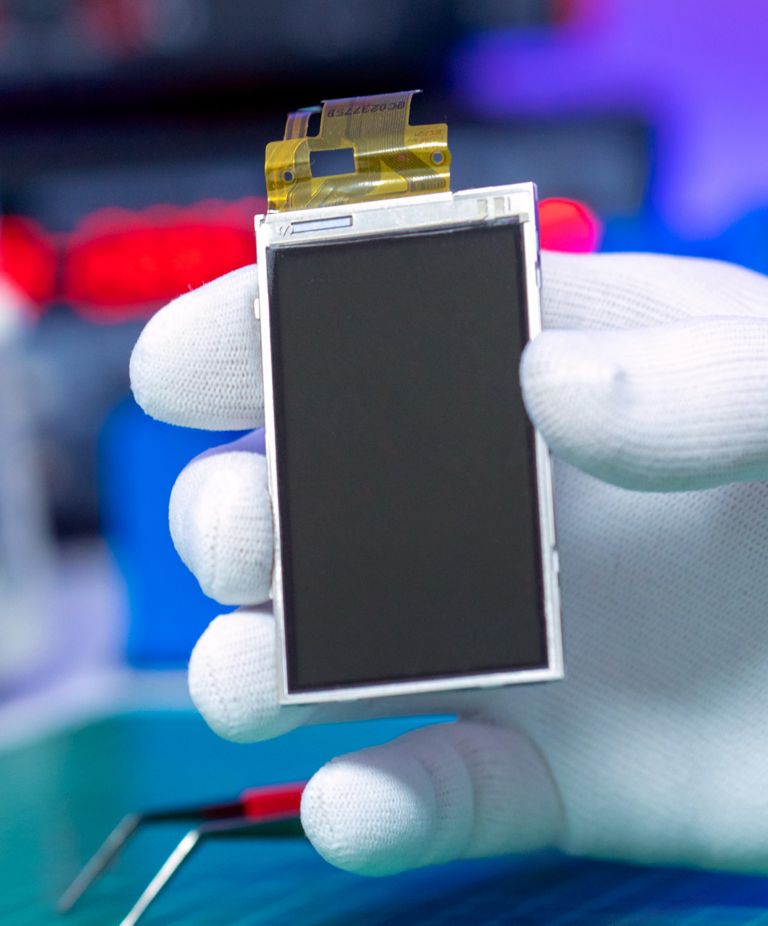 A person holds a small LCD display 