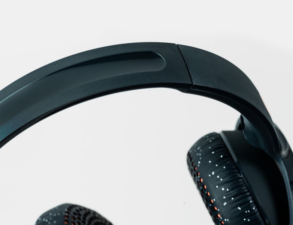 Close-up of black headphones with sparkly earpads. 