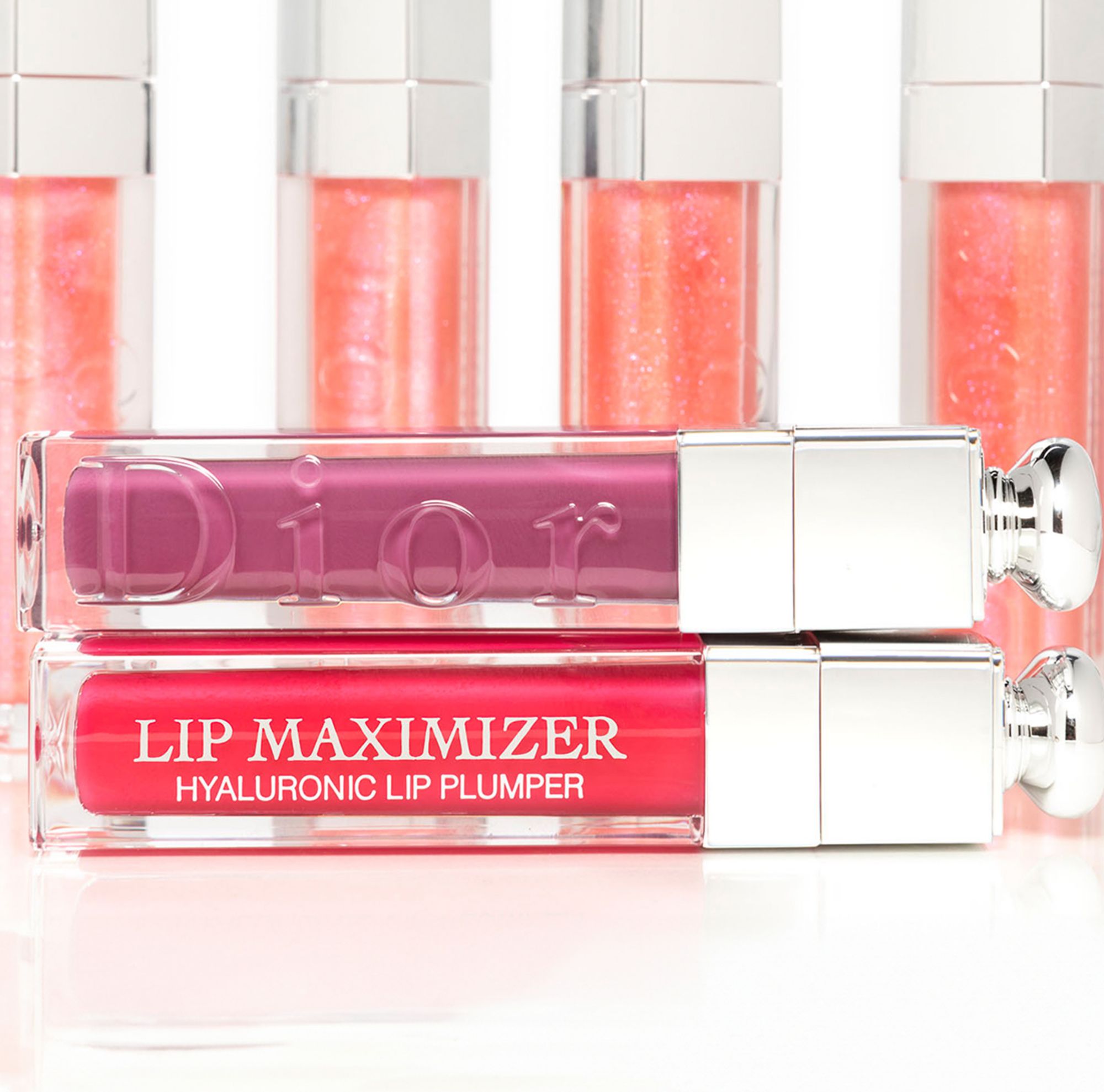 Two lip plumper bottles stacked together 