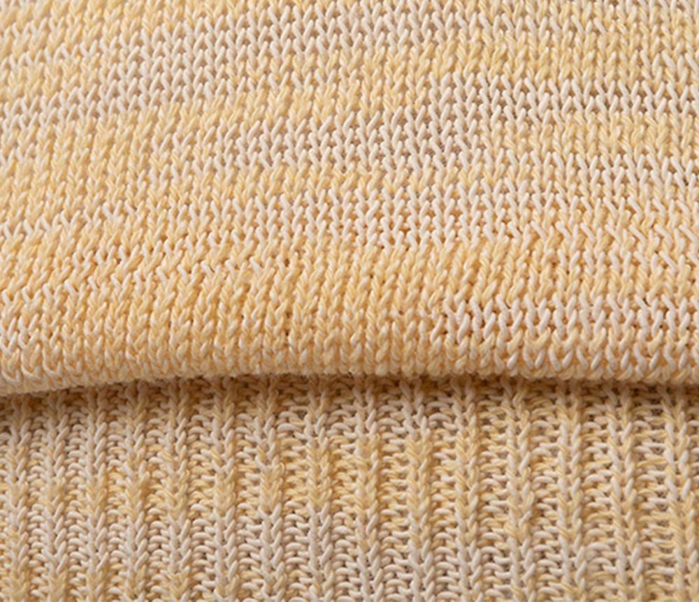 closeup orange knit folded sweater. 