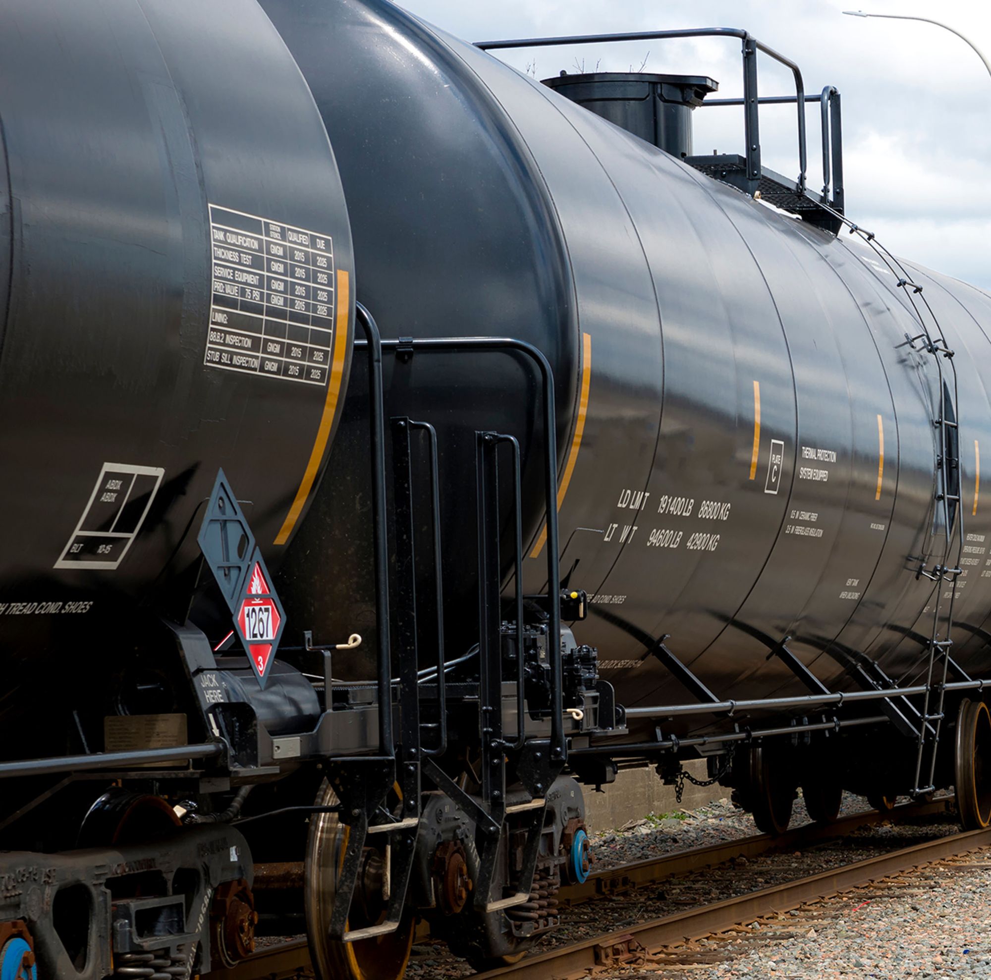 A railroad car stopped on the track. 