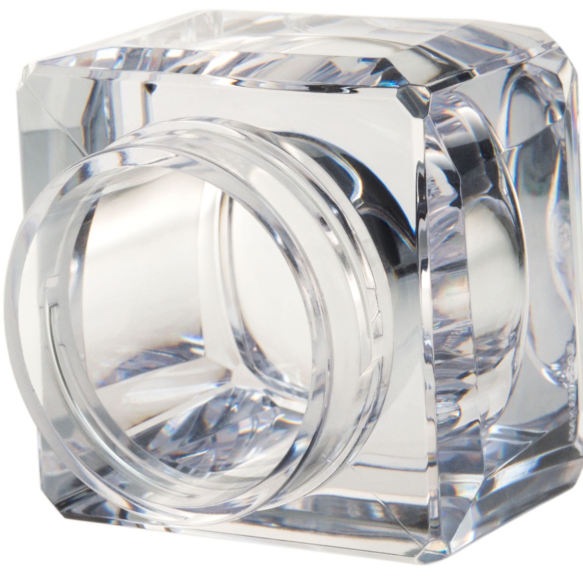 Close-up of an open, thick cosmetic jar 