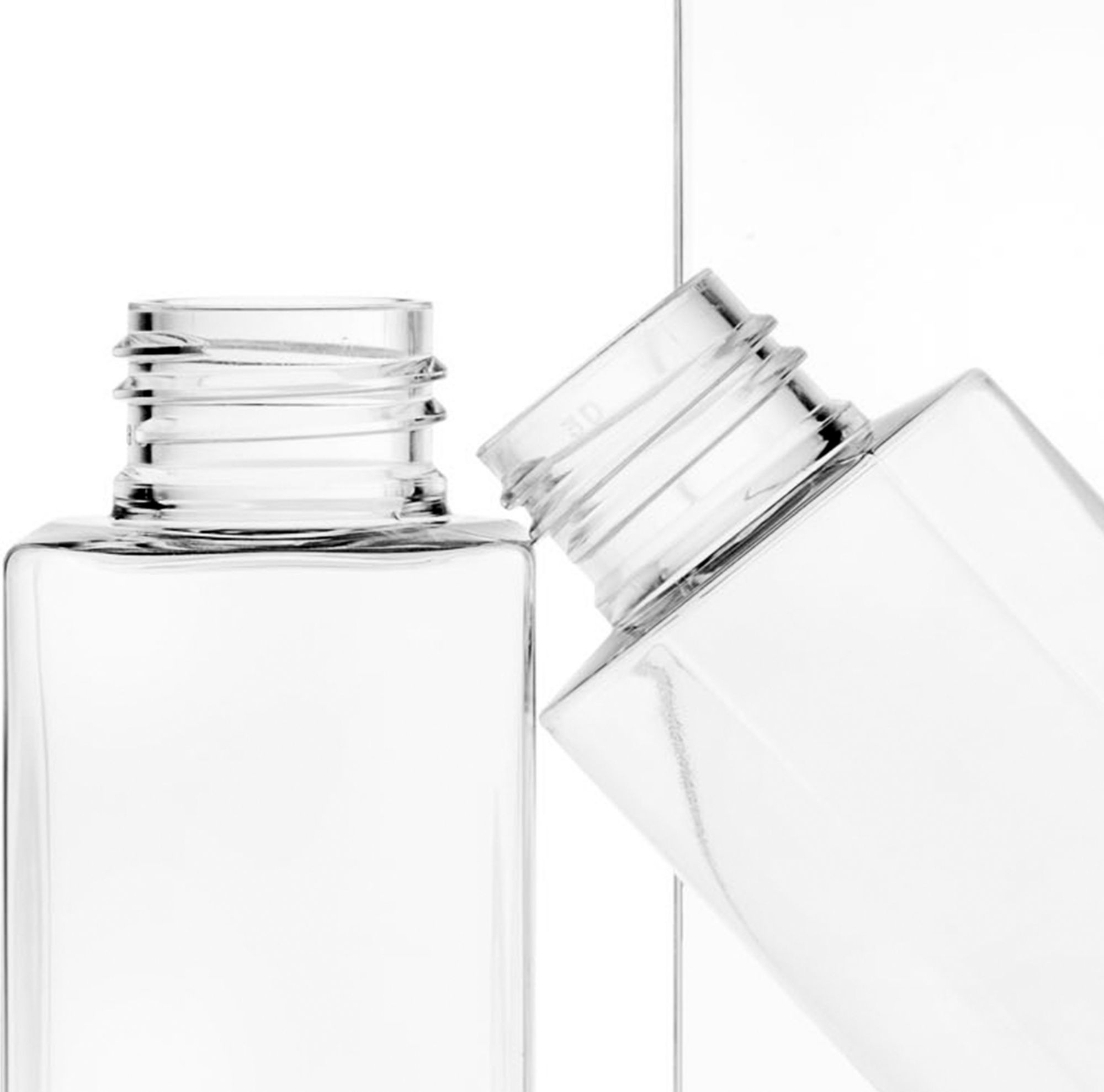 Close-up of two clear bottles 