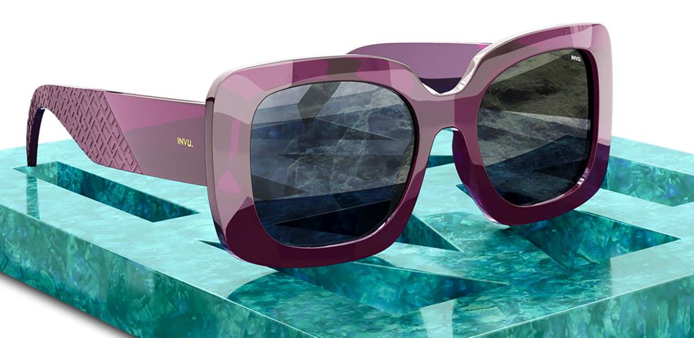 Sunglasses with purple plastic frames and ultra polarized lenses. 