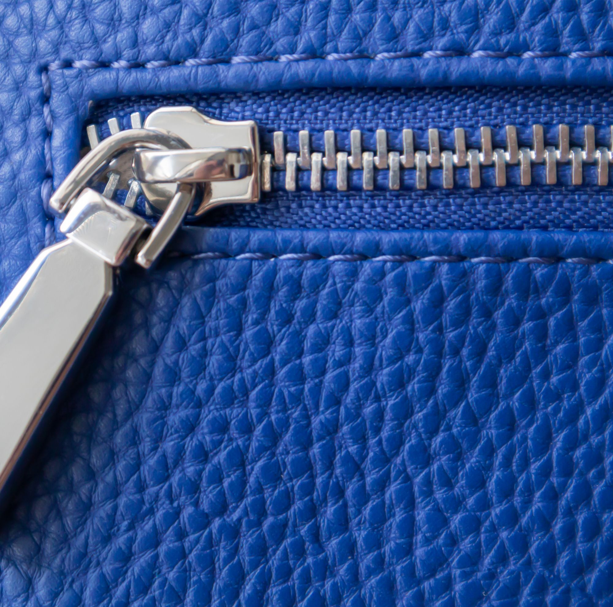 Closeup of zipper genuine leather purse. 