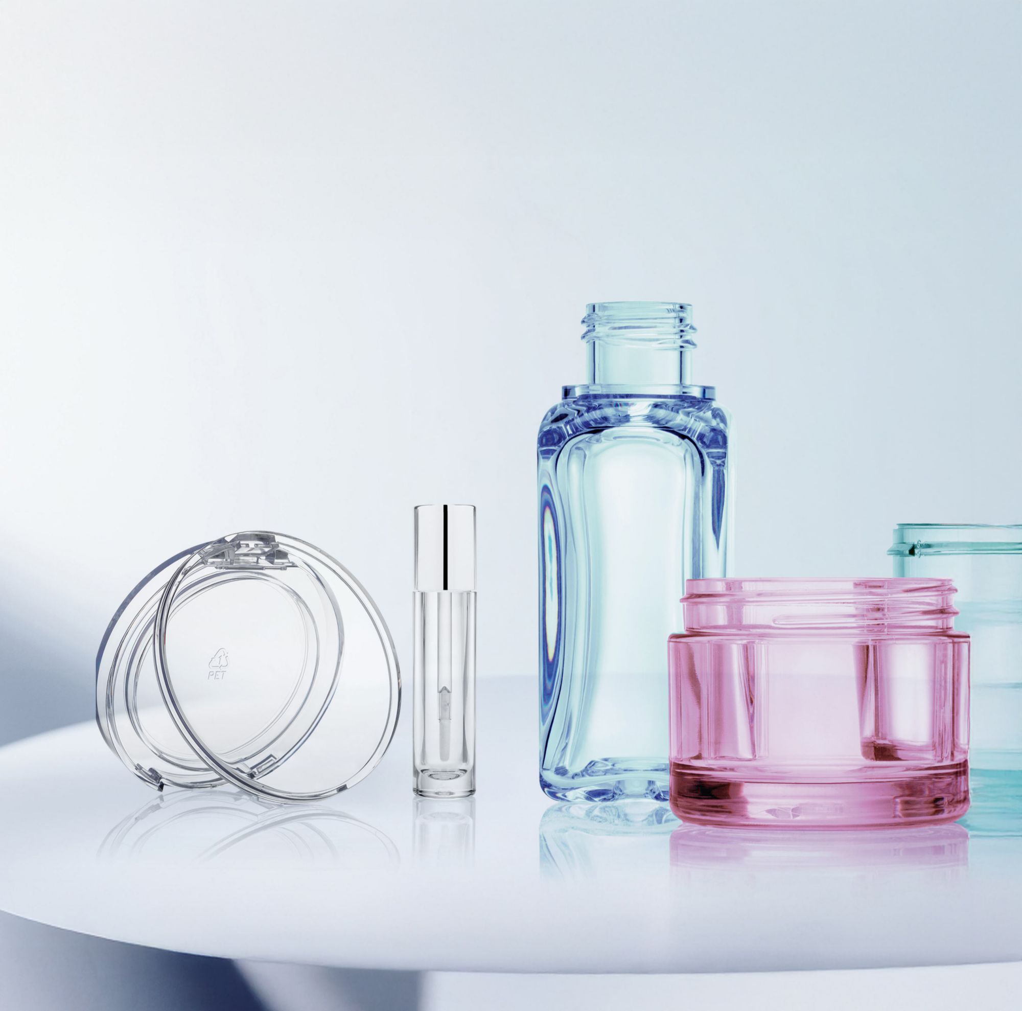 Transparent multi-colored cosmetic bottles made from Eastman Cristal. 