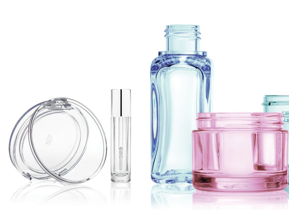 Translucent, multicolored cosmetic jars, bottles and compacts made from Cristal. 