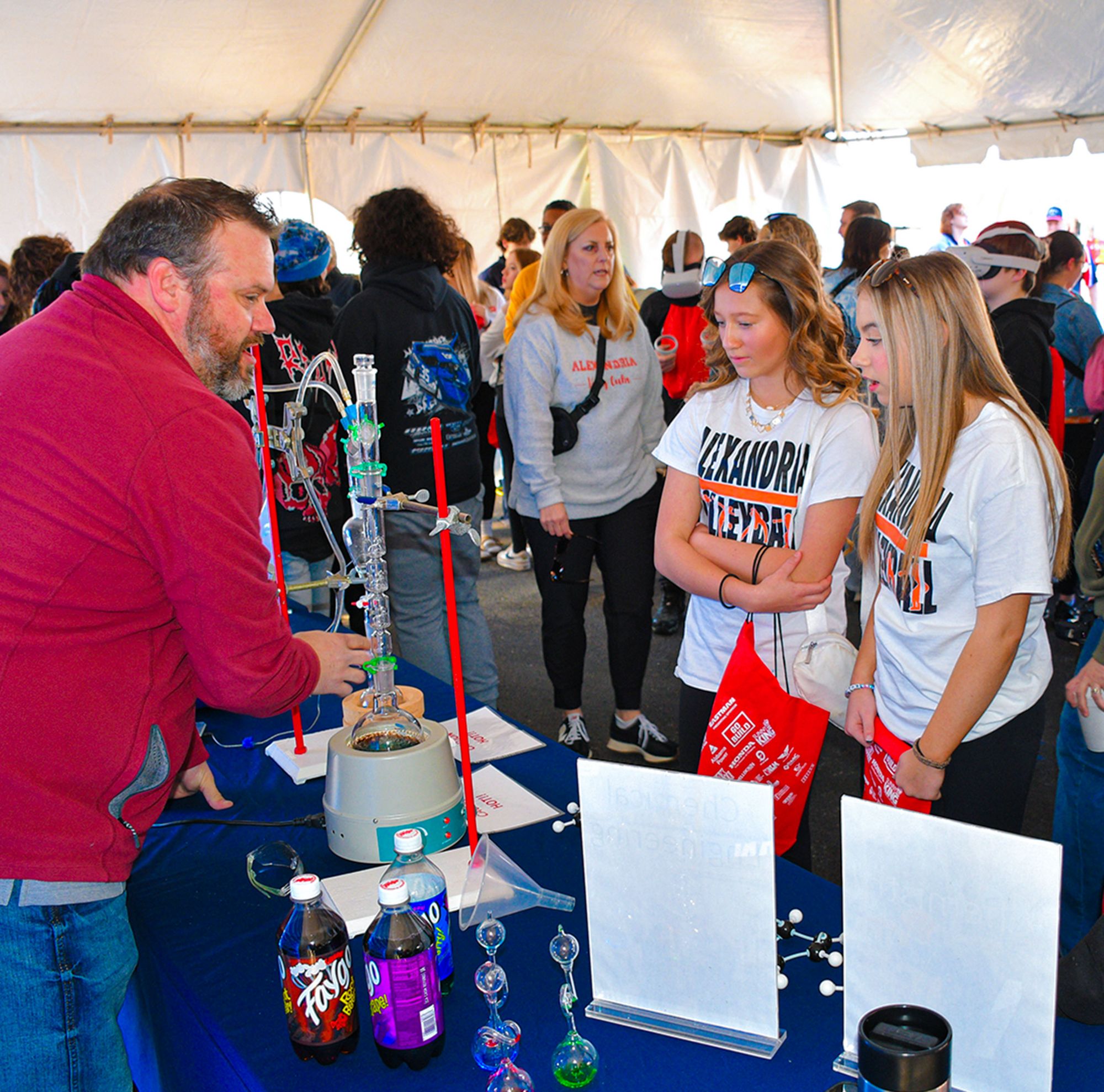 Community members gather during a science fair.  