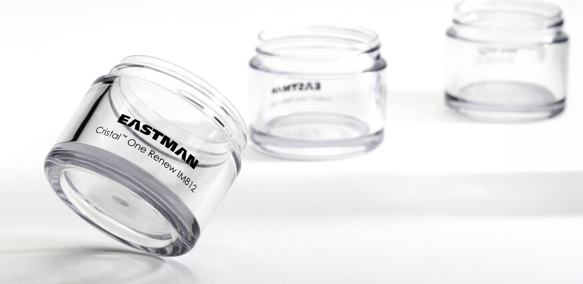 Three clear wide-mouth jars made from Eastman Cristal One Renew. 