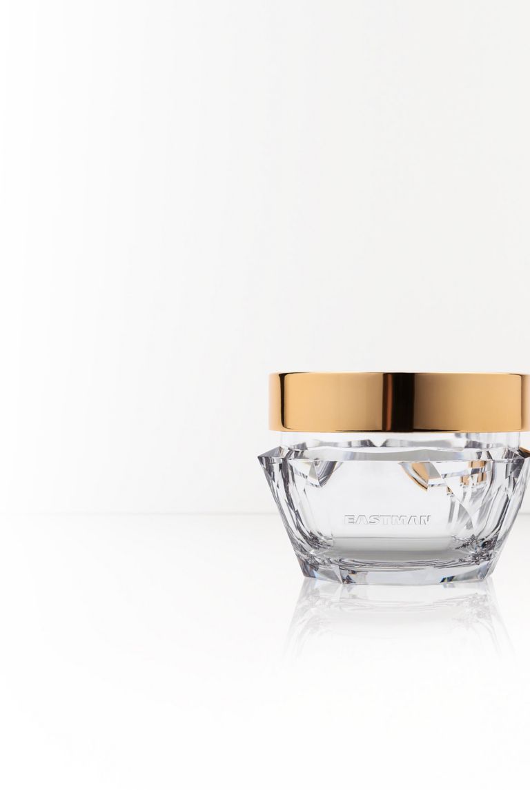 Two shiny glasslike jars made from Eastman Cristal One Renew IM812 sustainable resin. 