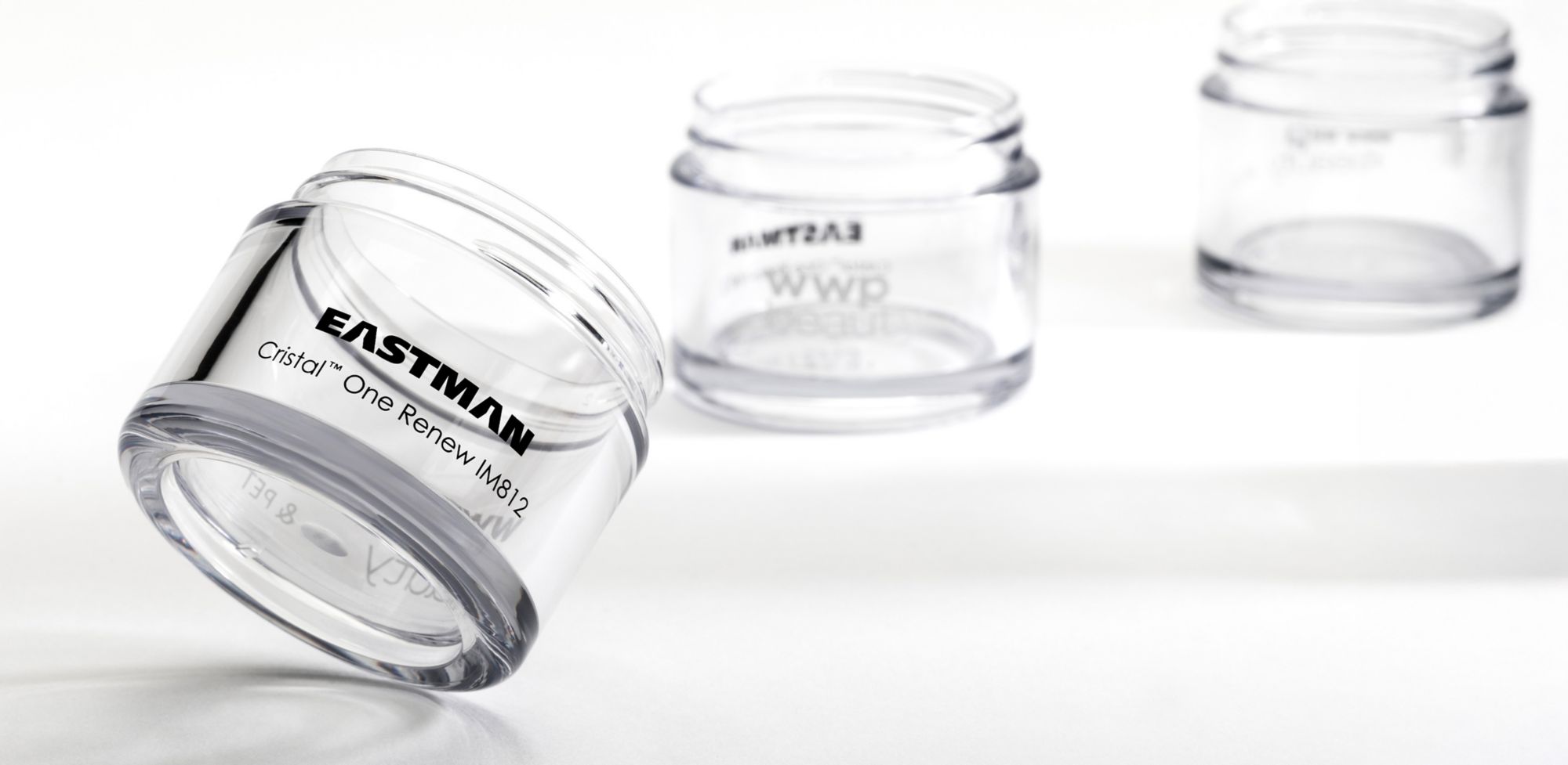 Three clear wide-mouth jars made from Eastman Cristal One Renew. 