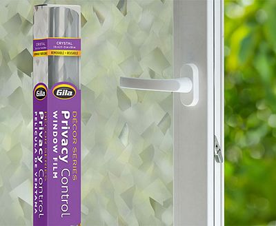Retail packaging displayed next to a window treated with the Crystal decorative film.