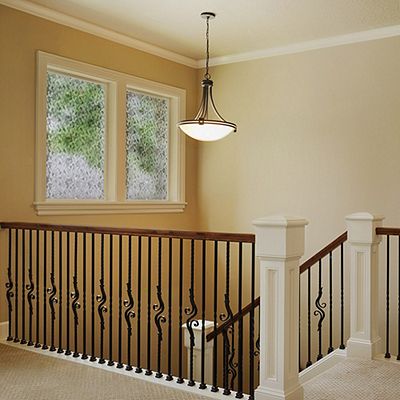 Interior view of Gila® Charcoal Decorative Window Film on windows over stairs