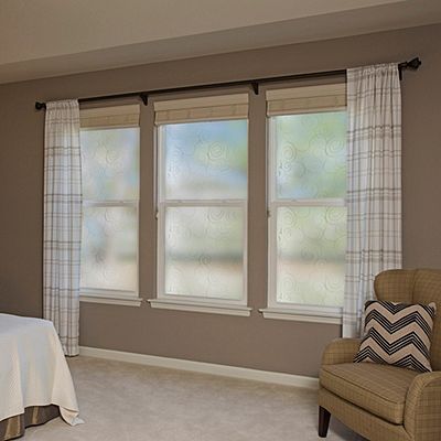 Interior view of Gila® Dusted Swirl Decorative Window Film in bedroom