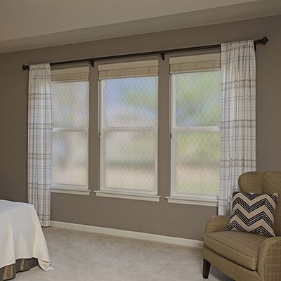 Interior view of Gila® Frosted Lattice Decorative Window Film in bedroom