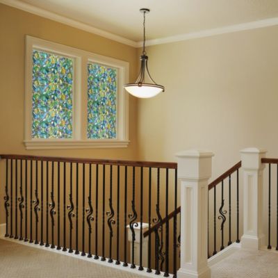 Interior view of Gila® Grape Vine Decorative Window Film on windows over stairs