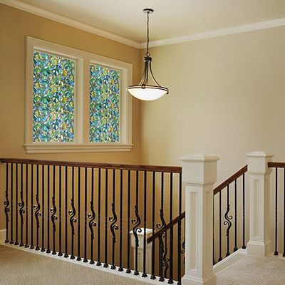 Interior view of Gila® Vineyard Decorative Window Film on windows over stairs