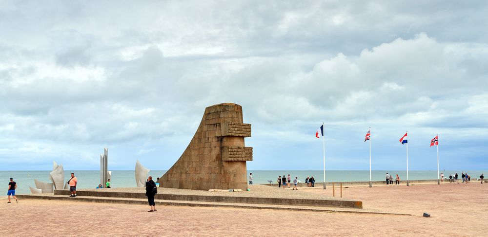 Tourists visit the D-day monument on Omaha beach in Normandy, France on August 2, 2014 