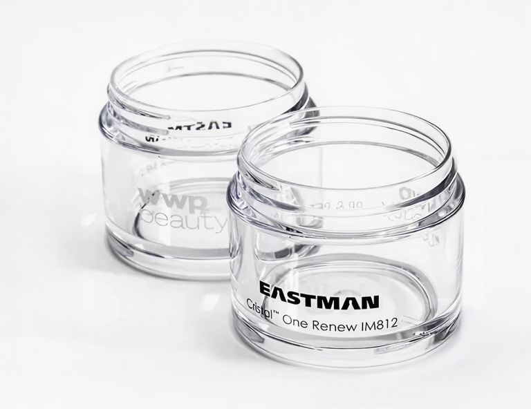 Two clear Cristal One Renew jars. 