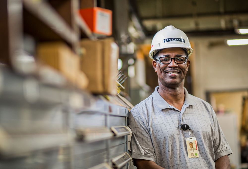 An Eastman employee in a hard hat. 
