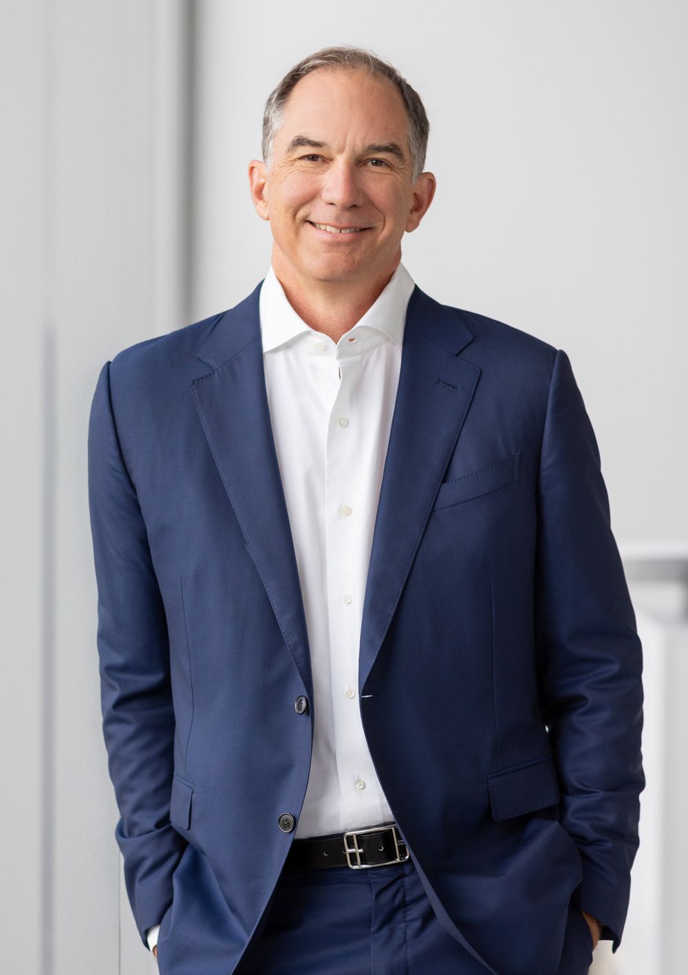 Photo of Mark Costa standing 