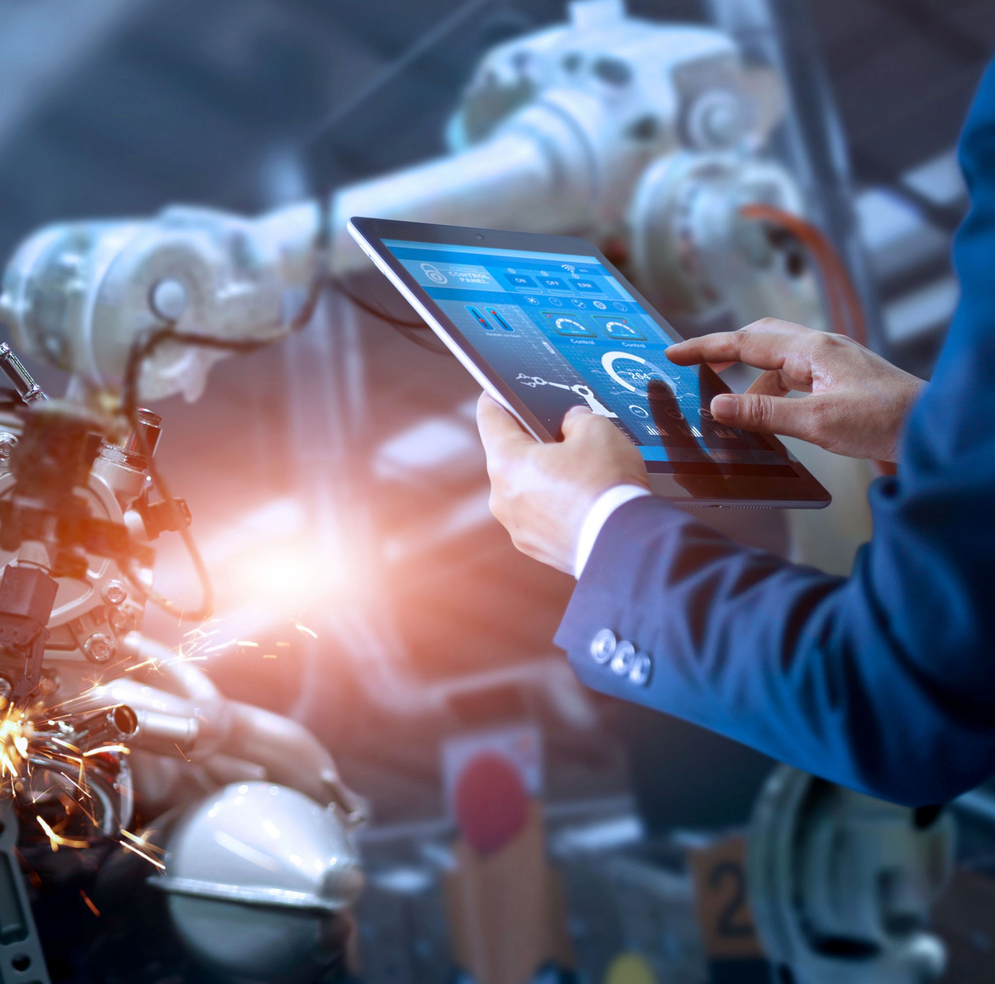 A person operates a robot using a tablet 