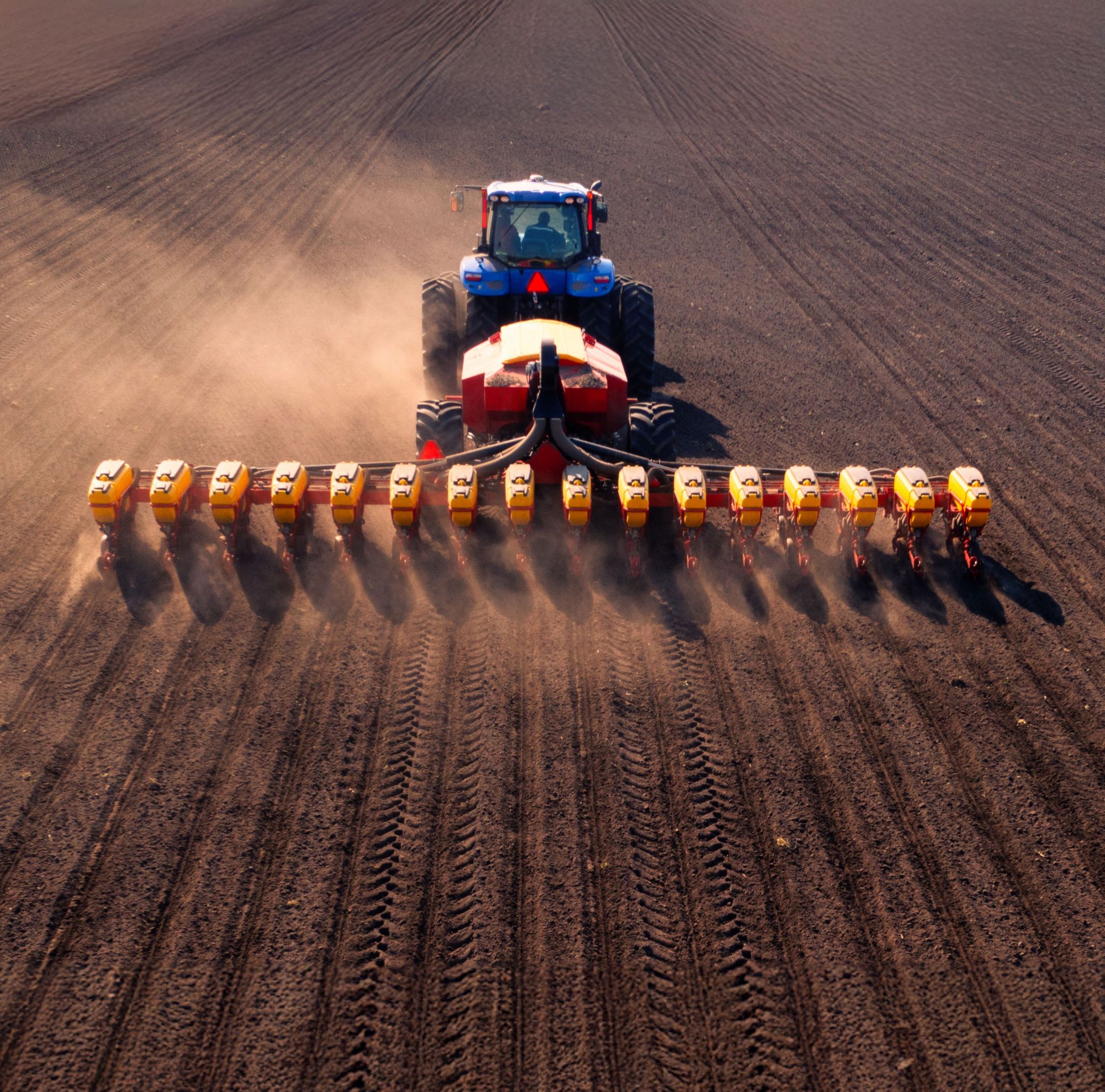 Aerial view of a tractor with a seeder. 