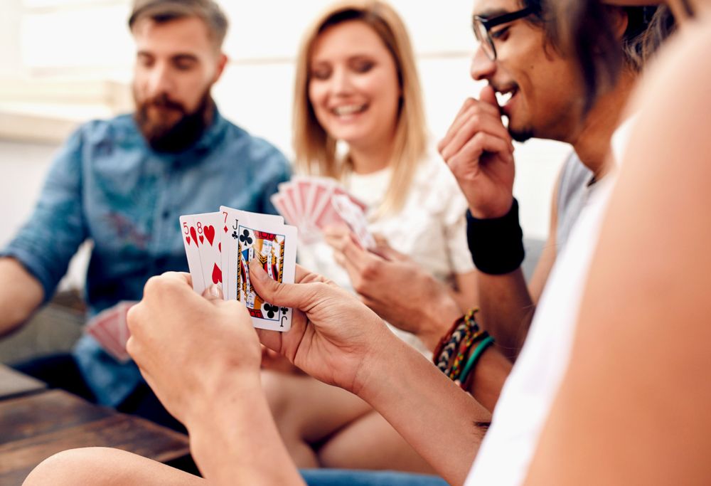A person reviewing the cards in their hand. 